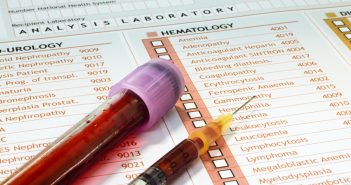 New biomarker panel could diagnose post-traumatic stress disorder Medical-report-with-a-tube-of-blood-and-syringe-blood-test